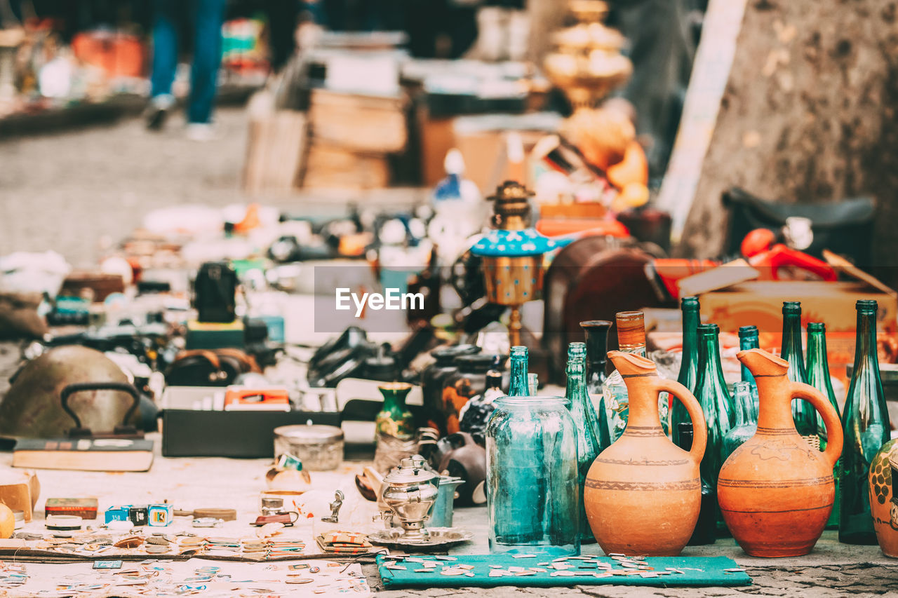 Various container displayed for sale at market stall