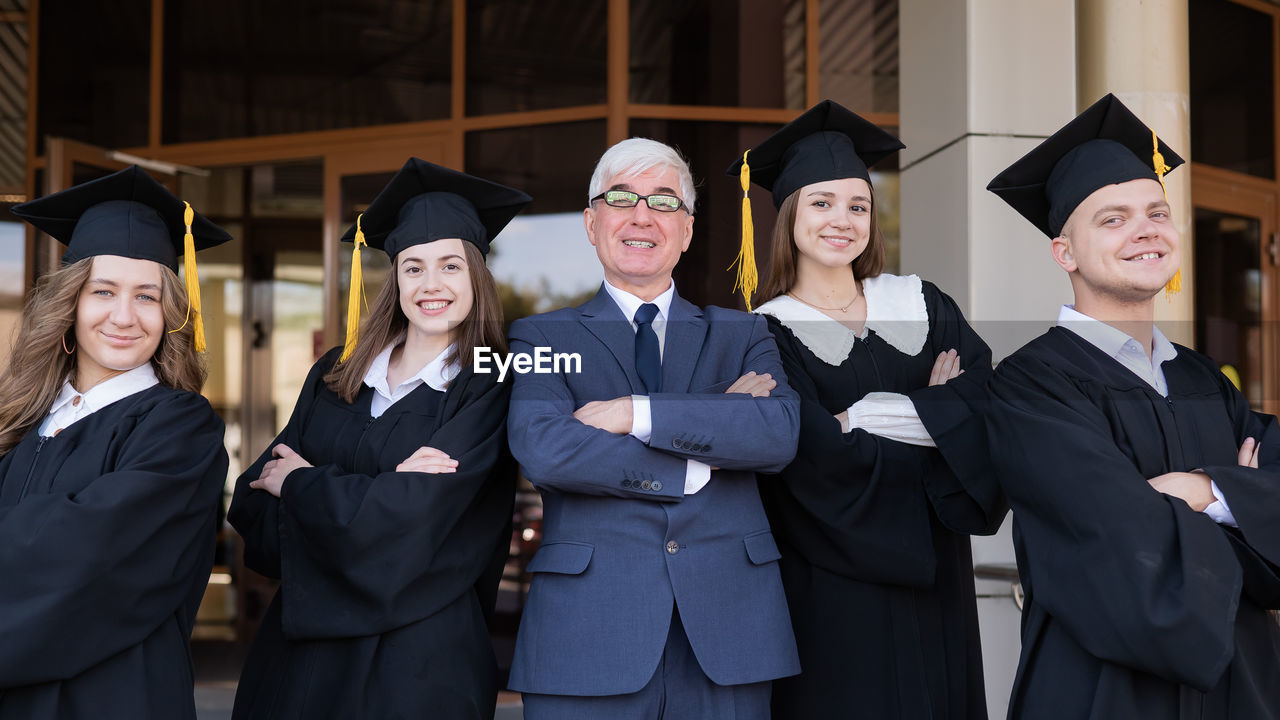 portrait of smiling woman wearing graduation