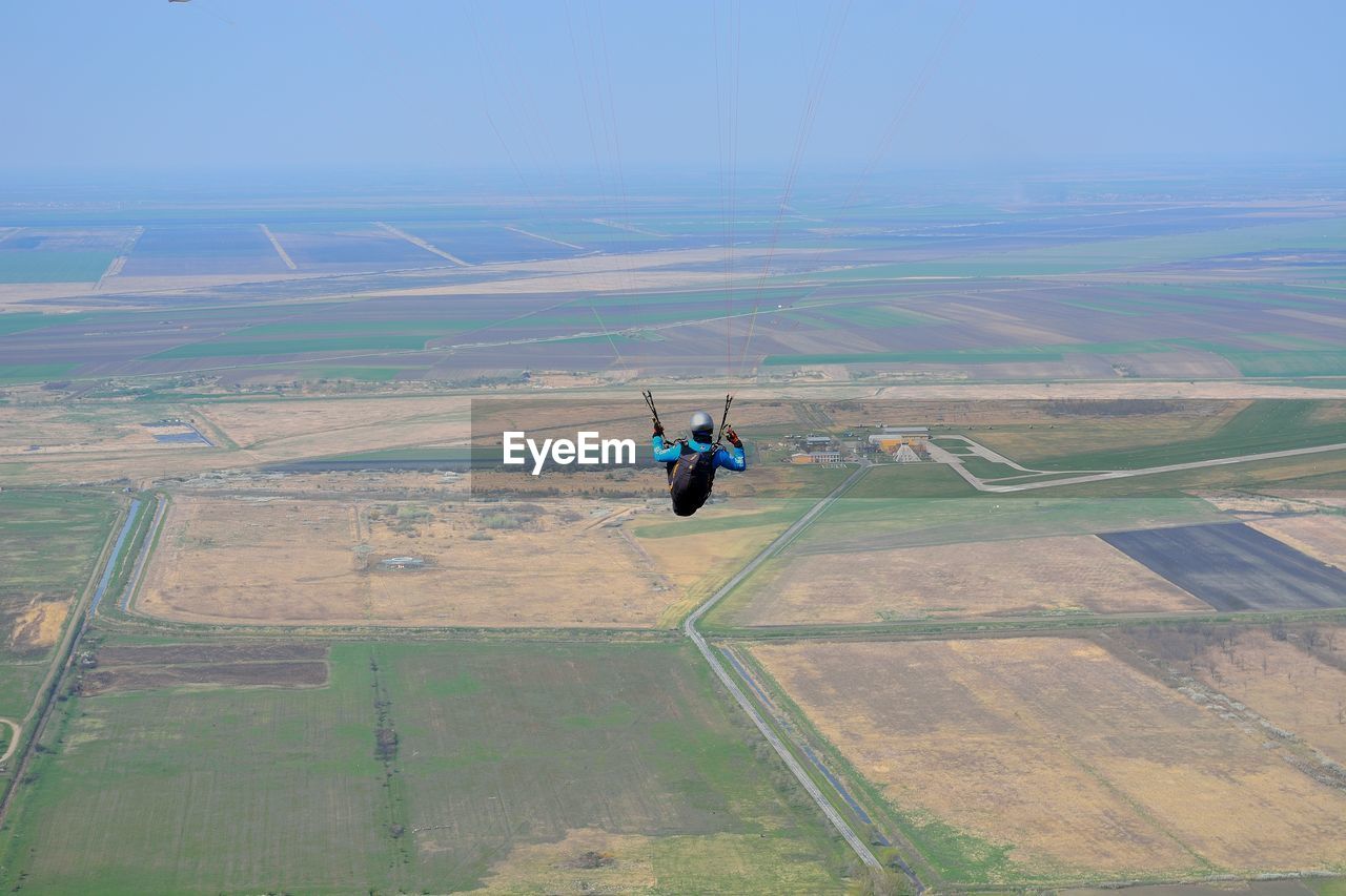 View of person paragliding mid-air