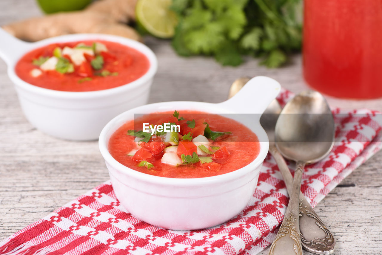 Watermelon tomato gazpacho in bowls. traditional spanish cold soup.