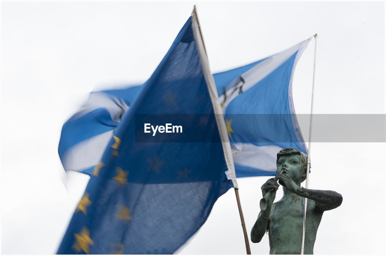 Statue against blue sky