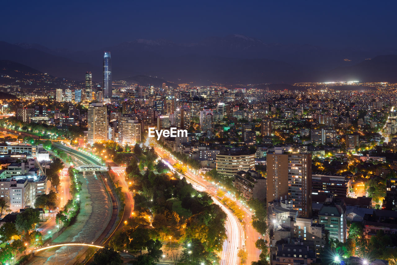 High angle view of illuminated city buildings at night