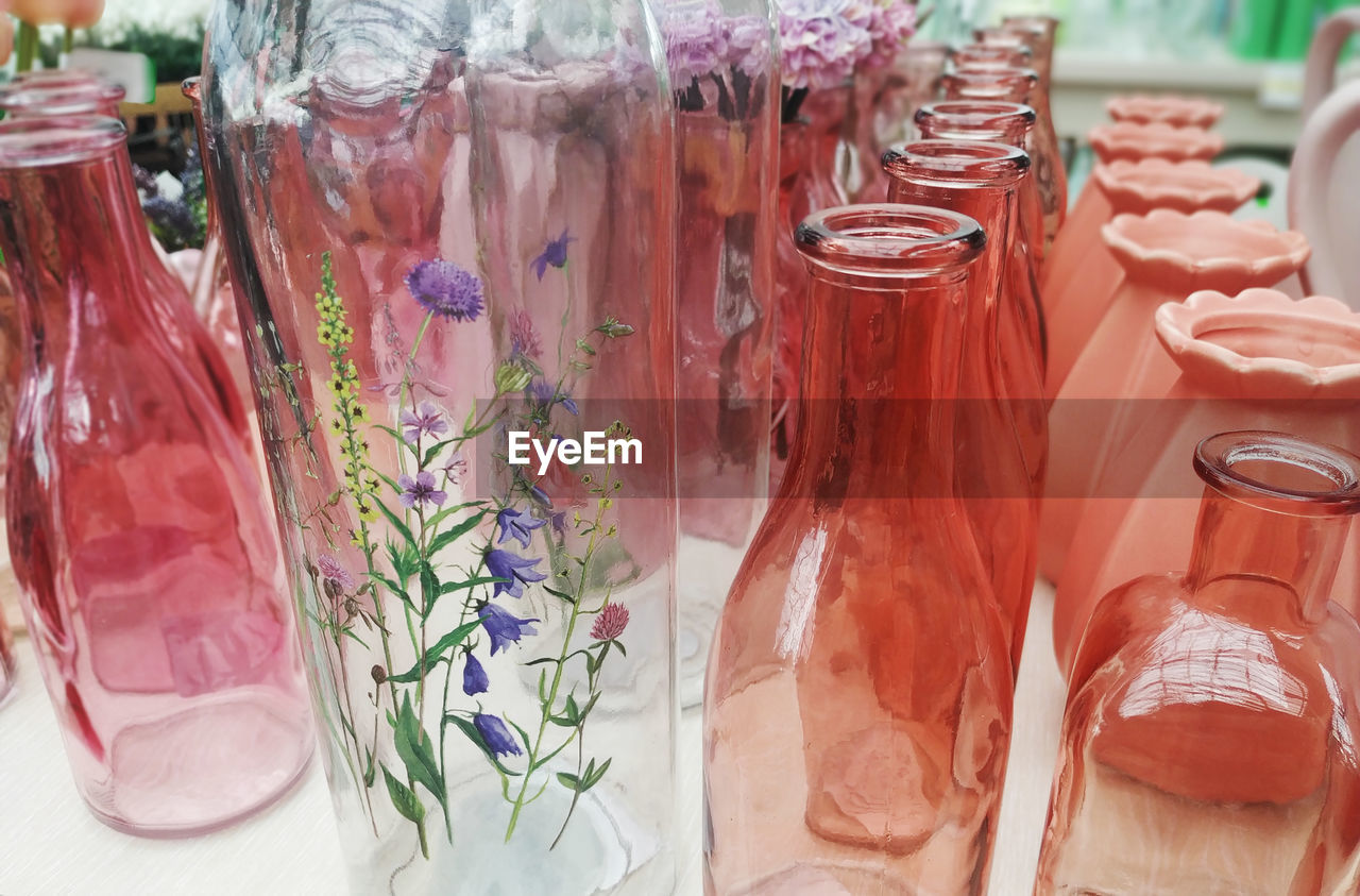 CLOSE-UP OF GLASS JAR ON TABLE AT HOME