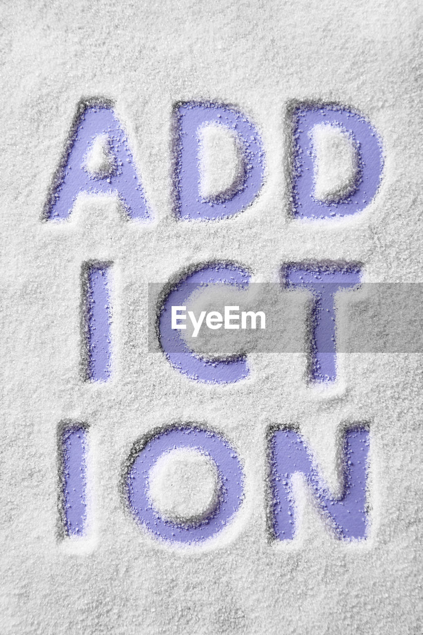 Directly above shot of text on snow