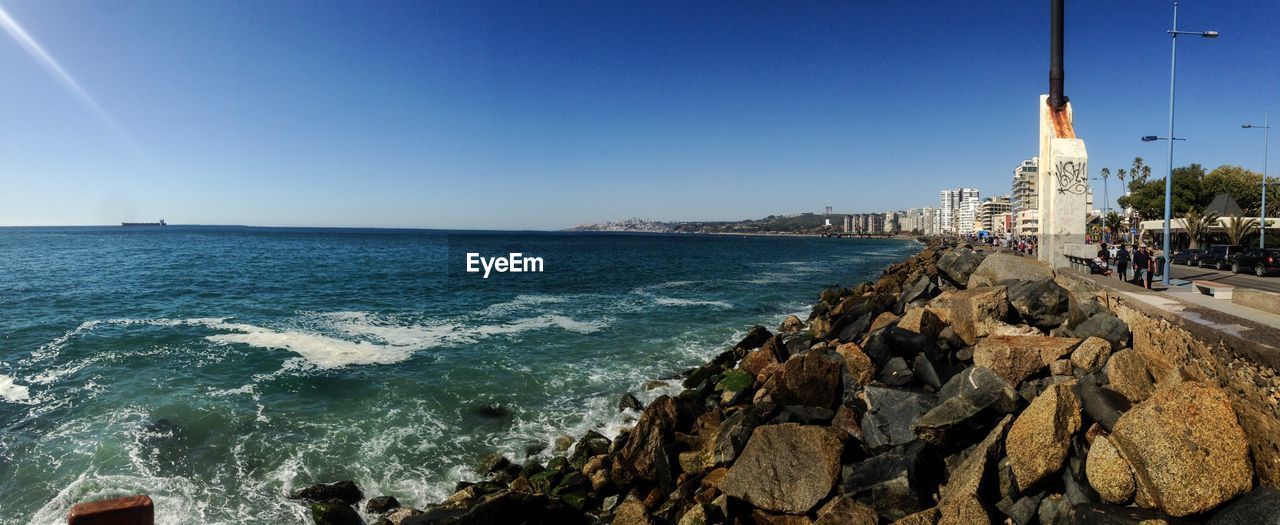 PANORAMIC SHOT OF SEA AGAINST CLEAR BLUE SKY
