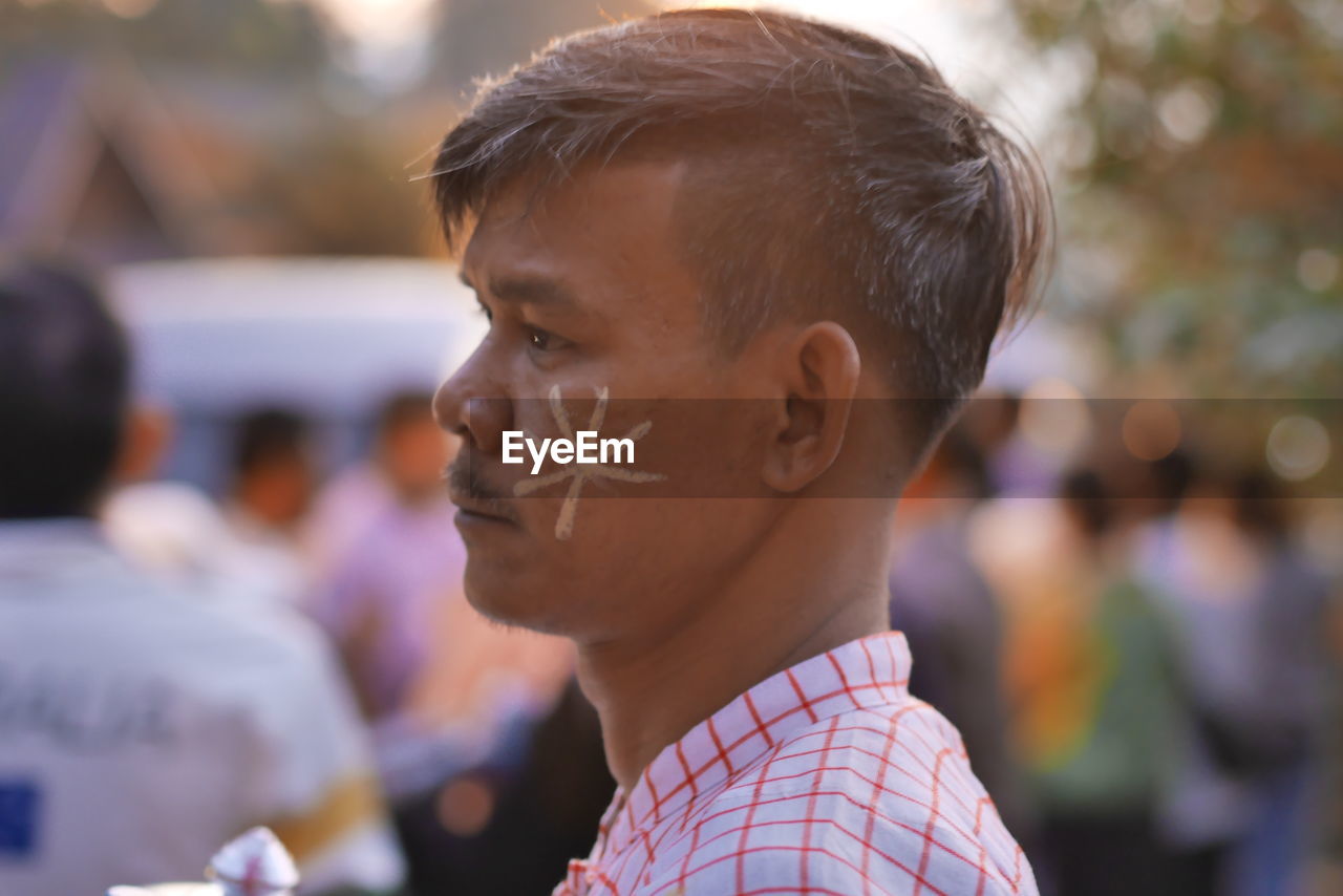 Close-up of man with face paint during event