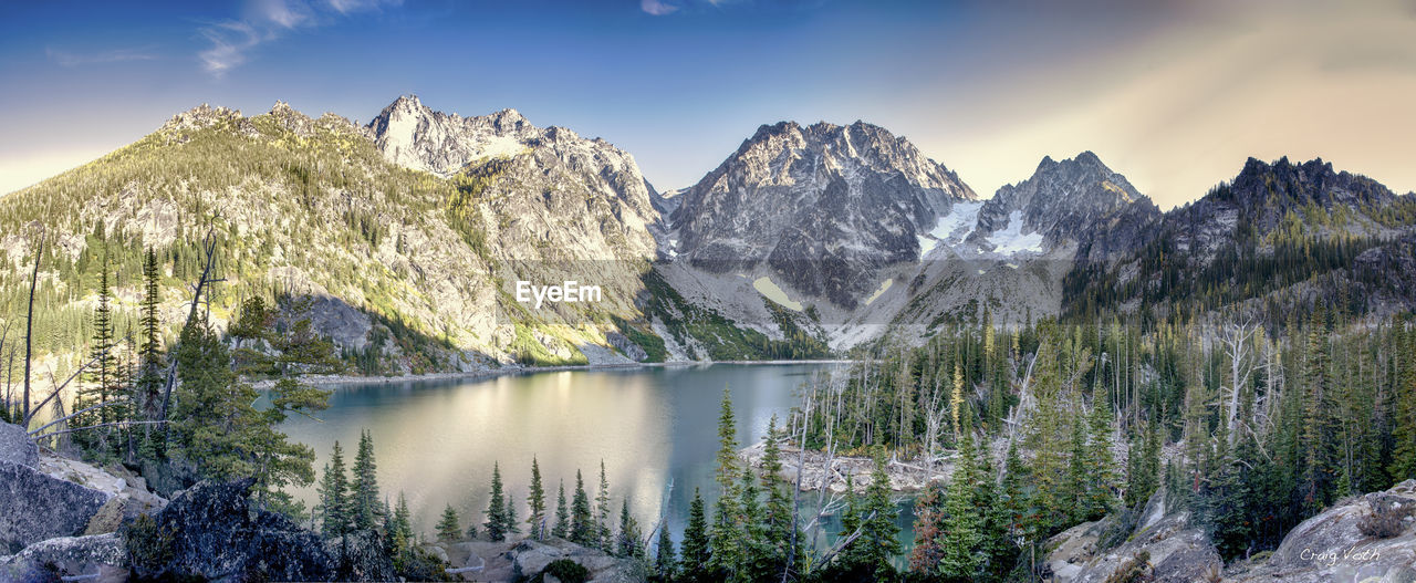 Scenic view of lake and mountains during winter