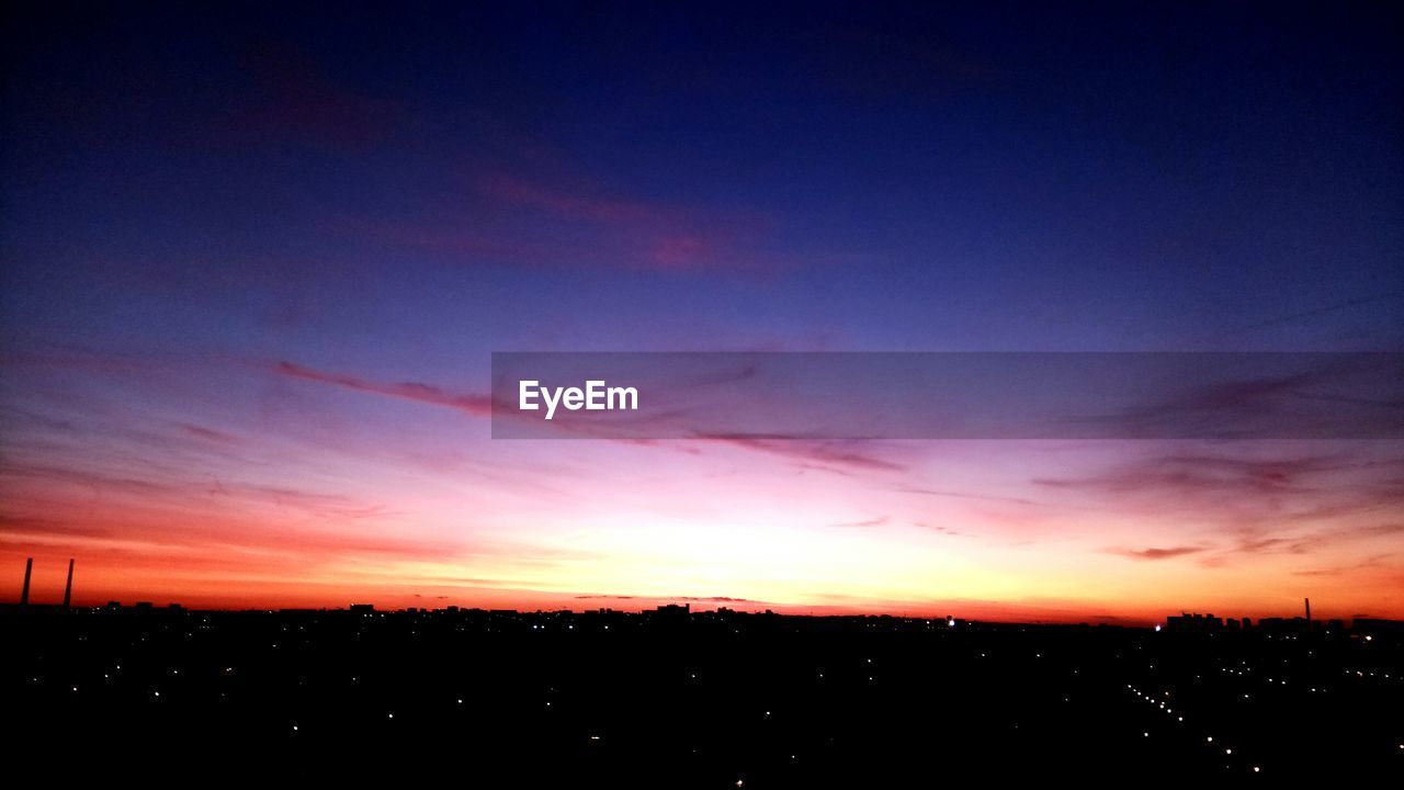 SCENIC VIEW OF SILHOUETTE LANDSCAPE AGAINST SKY DURING SUNSET