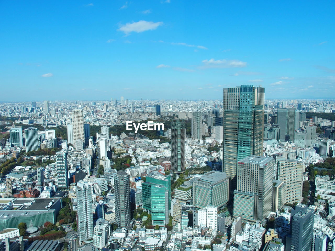 HIGH ANGLE VIEW OF MODERN BUILDINGS IN CITY