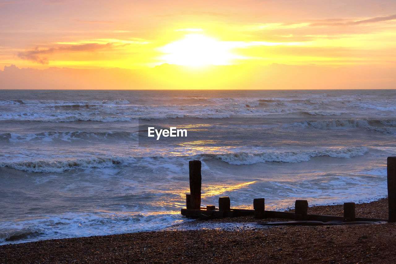 Scenic view of sea against sky during sunset