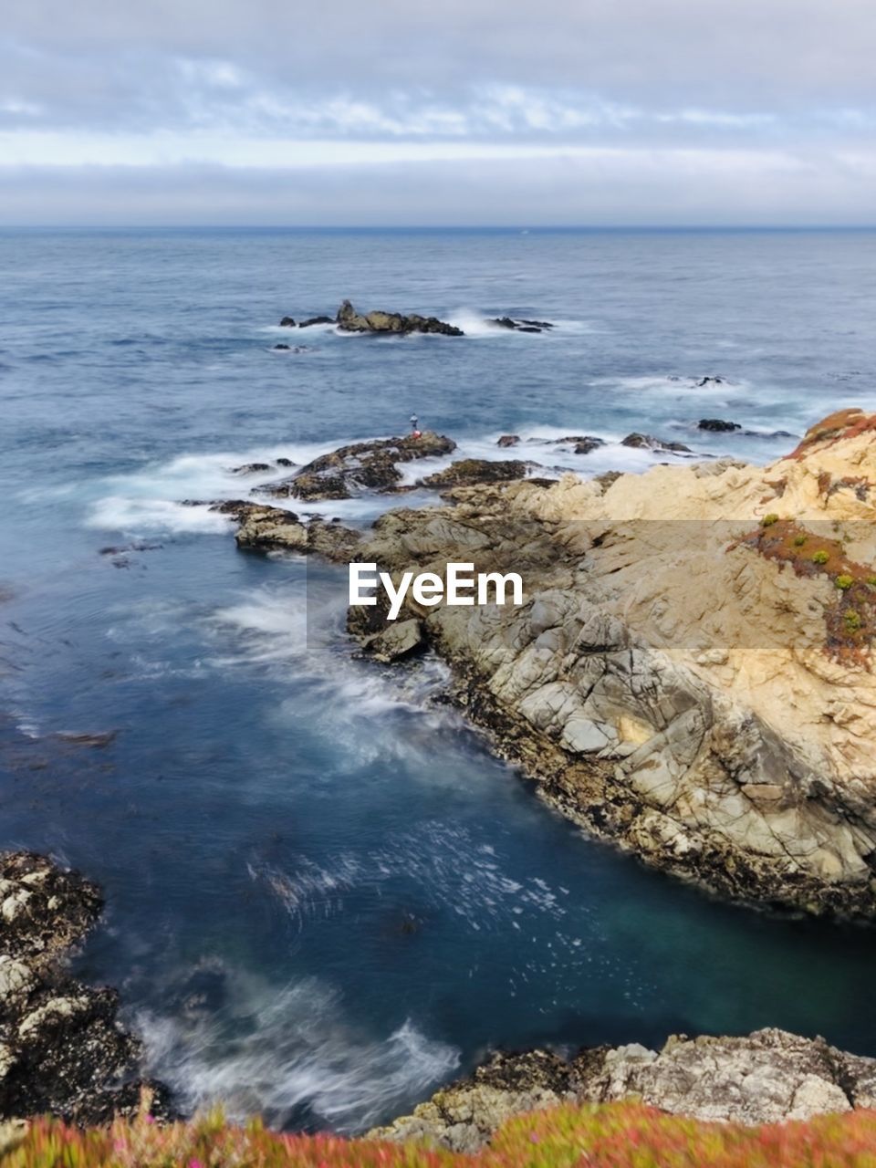 SCENIC VIEW OF ROCKS IN SEA