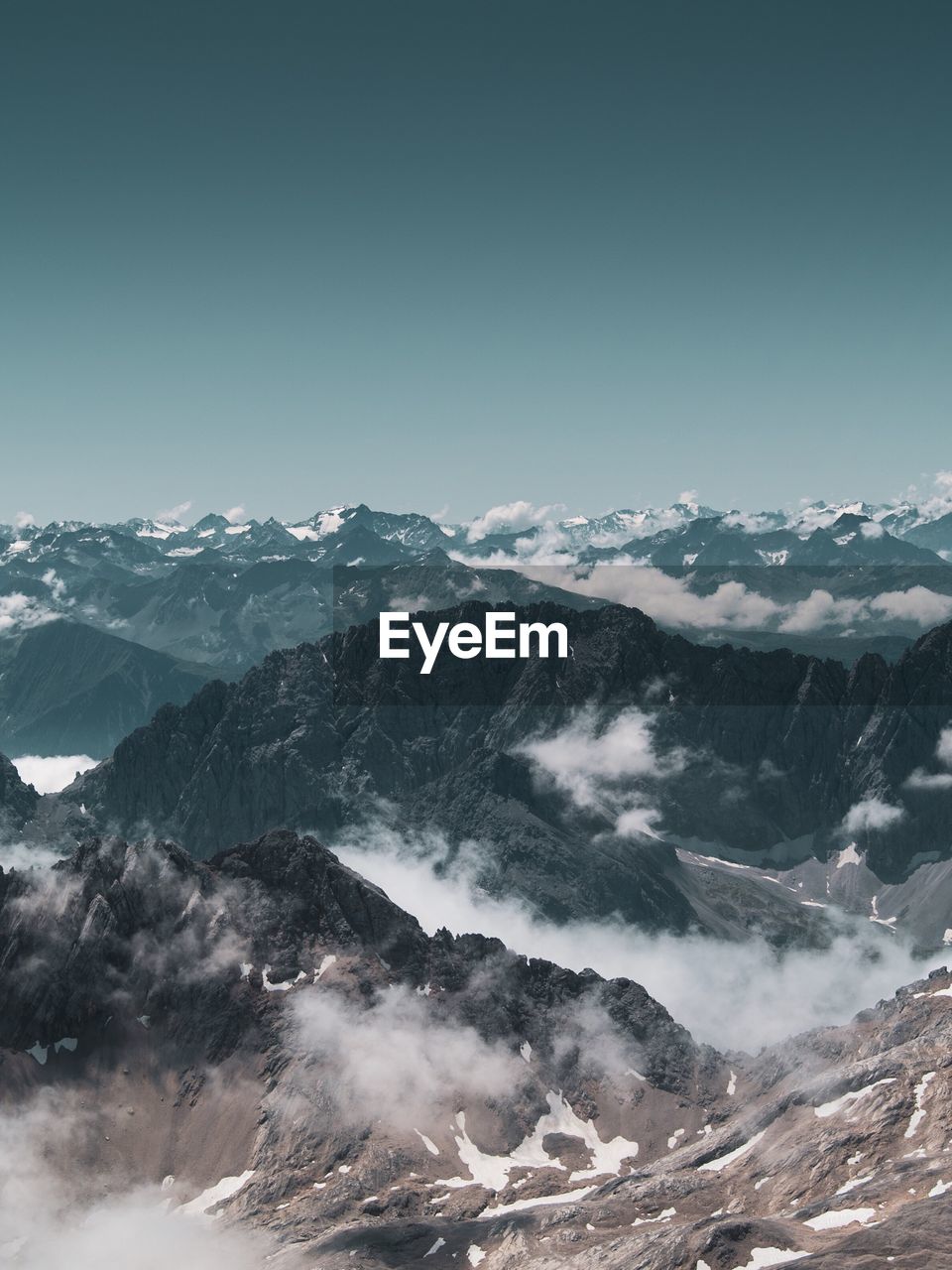 Scenic view of snowcapped mountains against clear sky