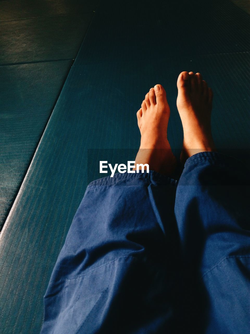 Low section of person on tatami mat