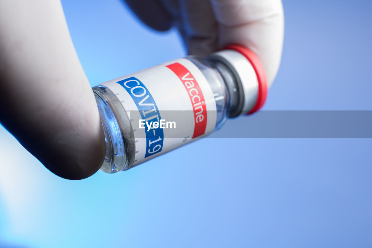 CLOSE-UP OF HUMAN HAND ON WHITE BACKGROUND