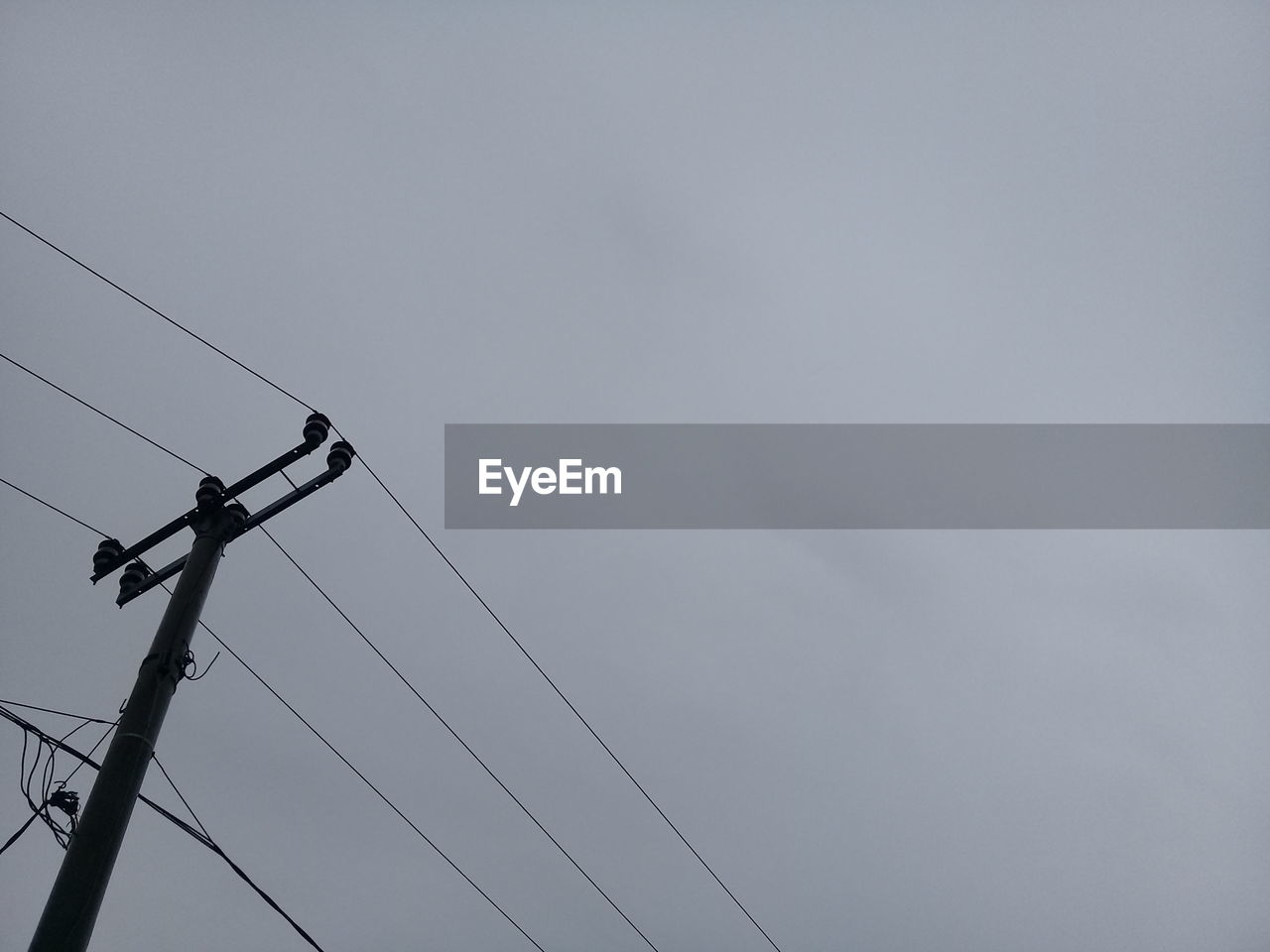 cable, electricity, technology, sky, line, power generation, low angle view, power supply, power line, overhead power line, no people, electricity pylon, nature, communication, telephone line, copy space, lighting, day, cloud, outdoors, wind, silhouette, telephone, telephone pole