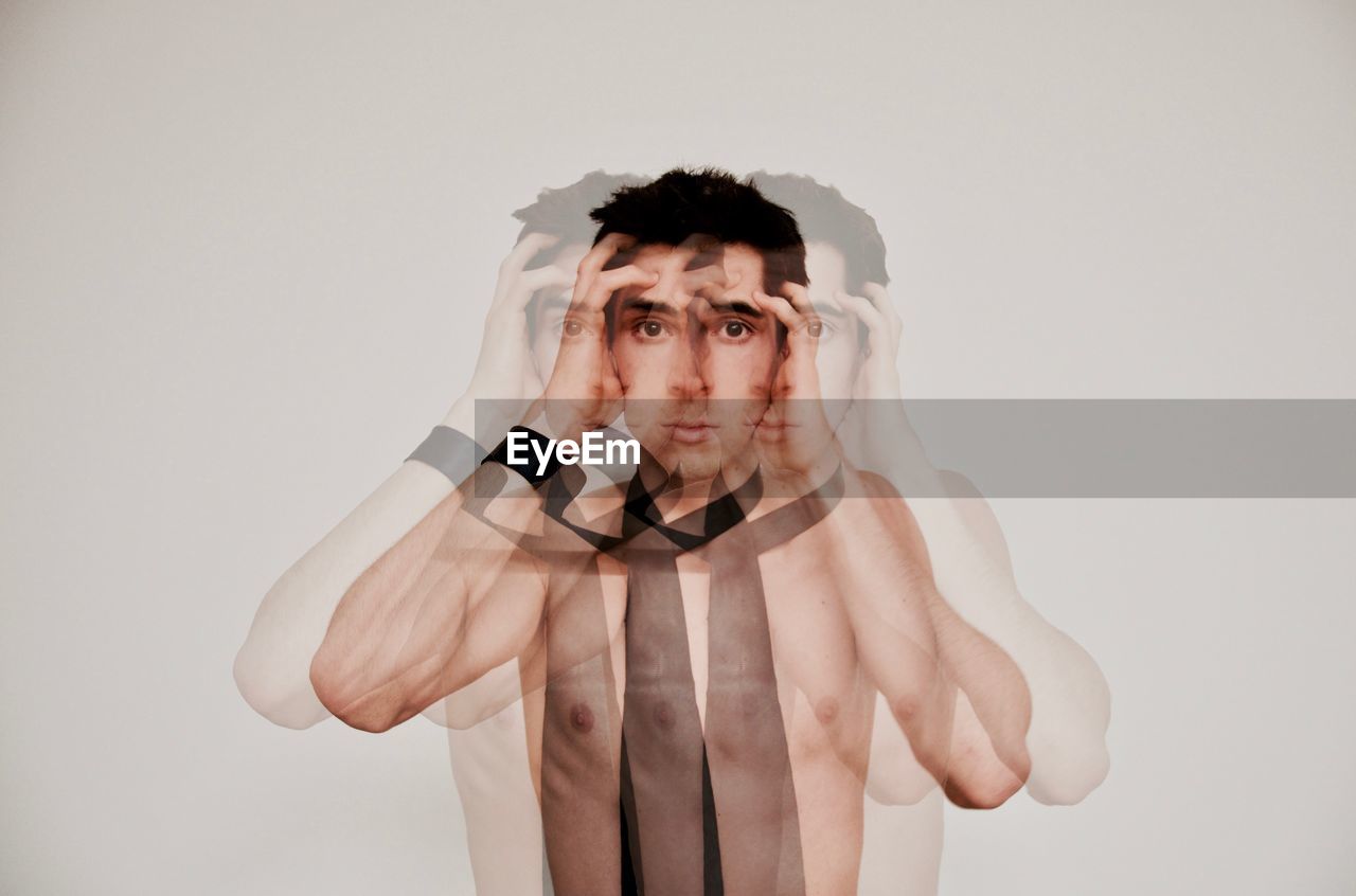 Multiple image of serious man over white background