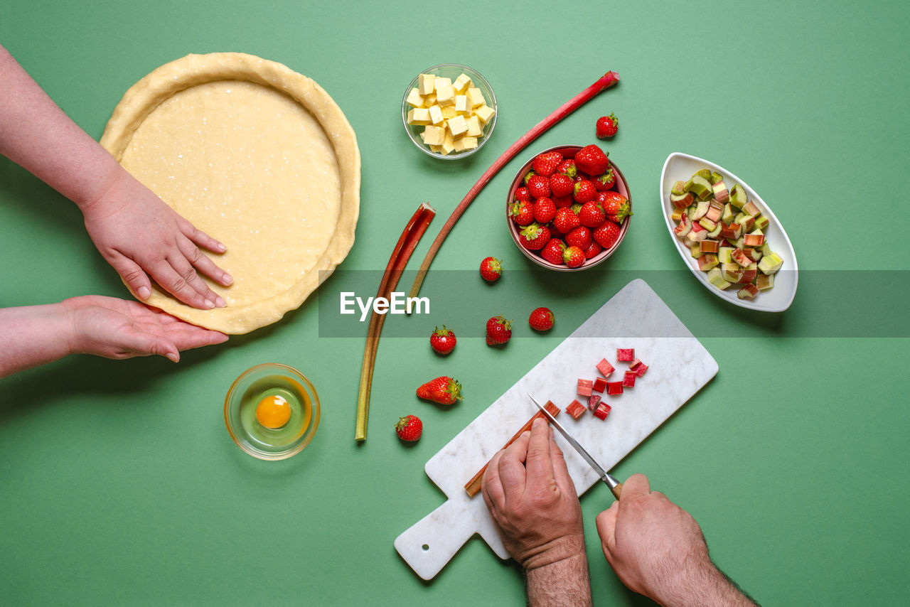 HIGH ANGLE VIEW OF WOMAN PREPARING FOOD