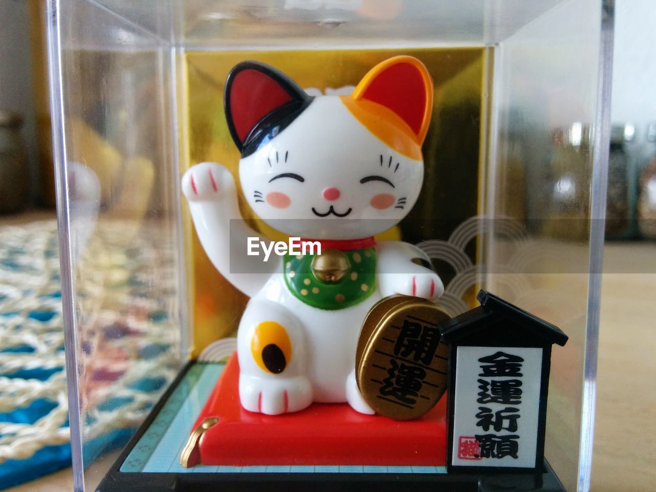Close-up of japanese lucky cat in box