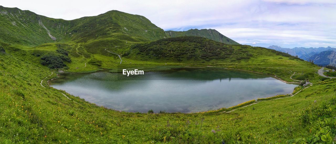 Panoramic view of lake amidst mountain against sky