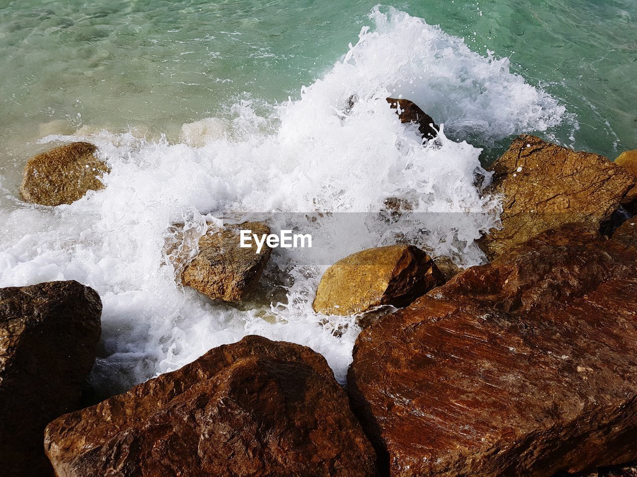 High angle view of rocks in sea