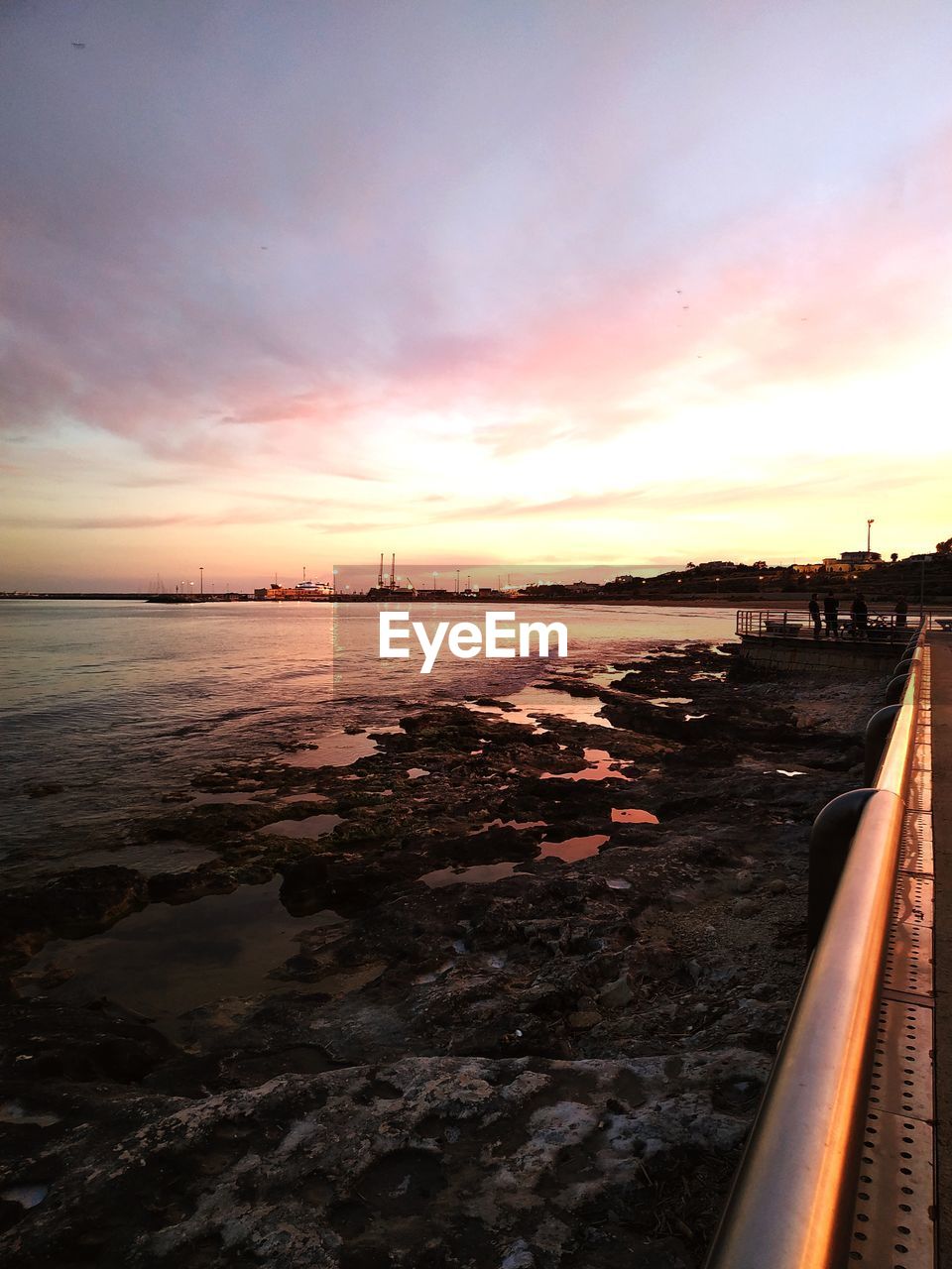 SCENIC VIEW OF BEACH DURING SUNSET