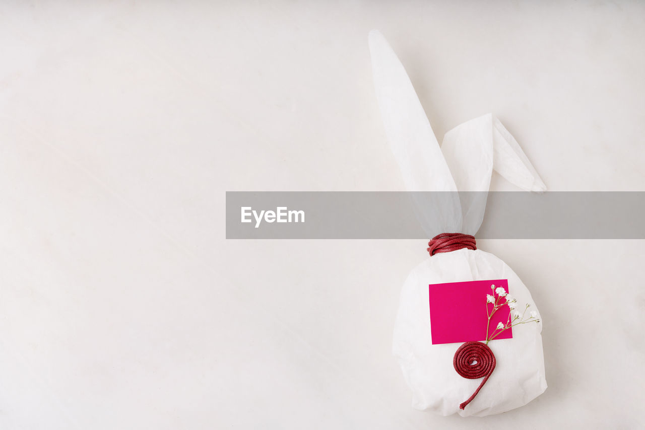 HIGH ANGLE VIEW OF CHRISTMAS DECORATIONS OVER WHITE BACKGROUND