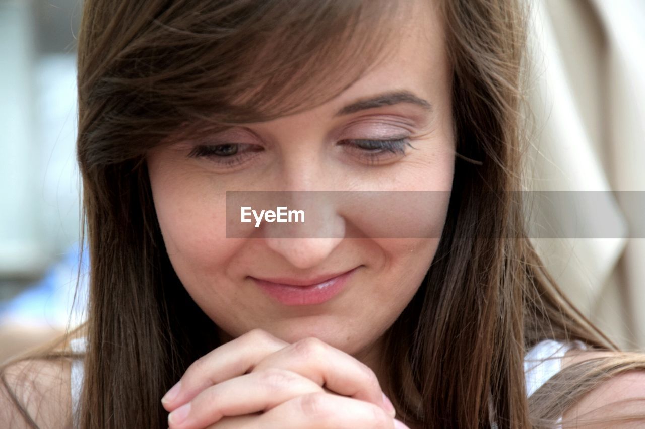 Close-up of young smiling woman