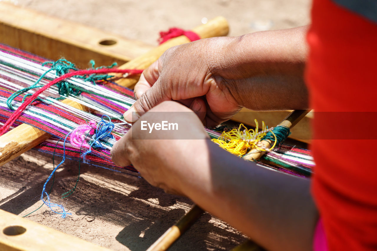 Cropped image of hands knitting