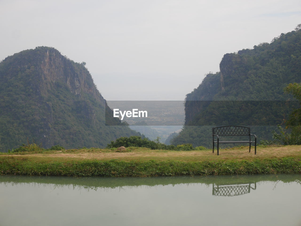 water, mountain, nature, environment, river, scenics - nature, reservoir, beauty in nature, reflection, landscape, sky, land, tranquility, no people, plant, mountain range, outdoors, travel destinations, tree, tranquil scene, travel, fog, tourism, highland, valley, rock, day, rural scene