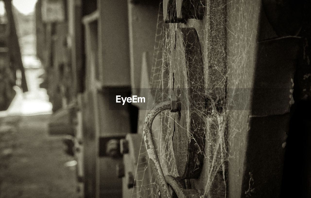 Close up of old machine with spider web