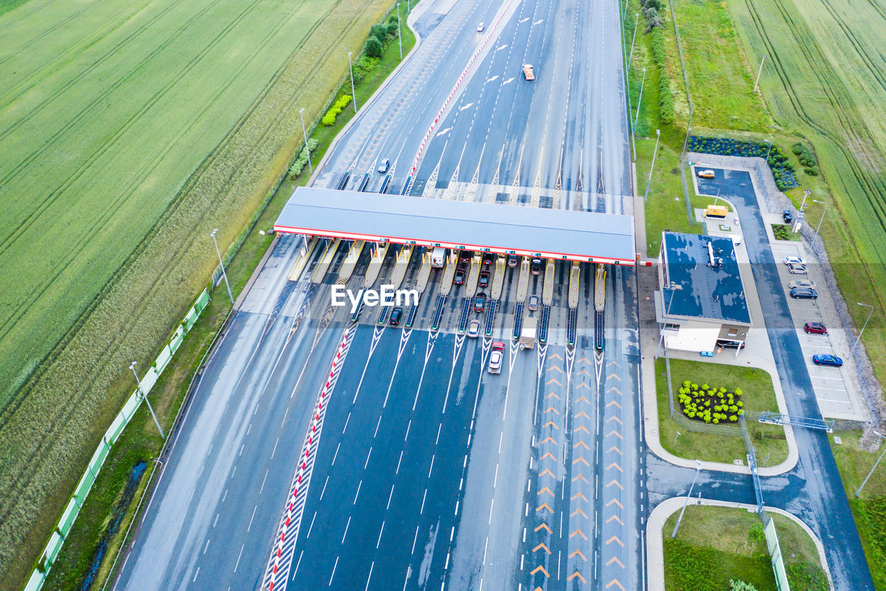 Transportation on multiple lanes  road and toll collection gate, drone aerial a2 poland lodz