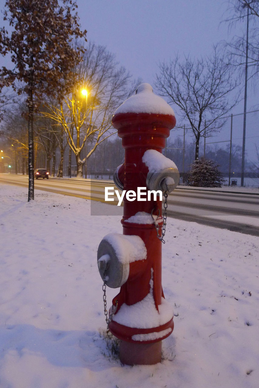 FIRE HYDRANT ON SNOW COVERED FIELD