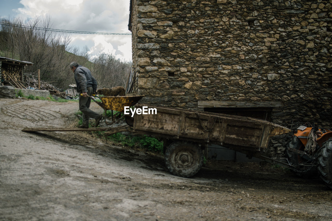 MAN WORKING ON MOTORCYCLE