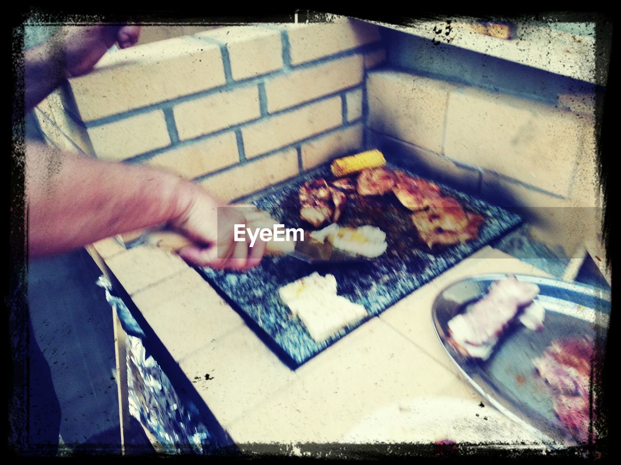 MAN PREPARING FOOD