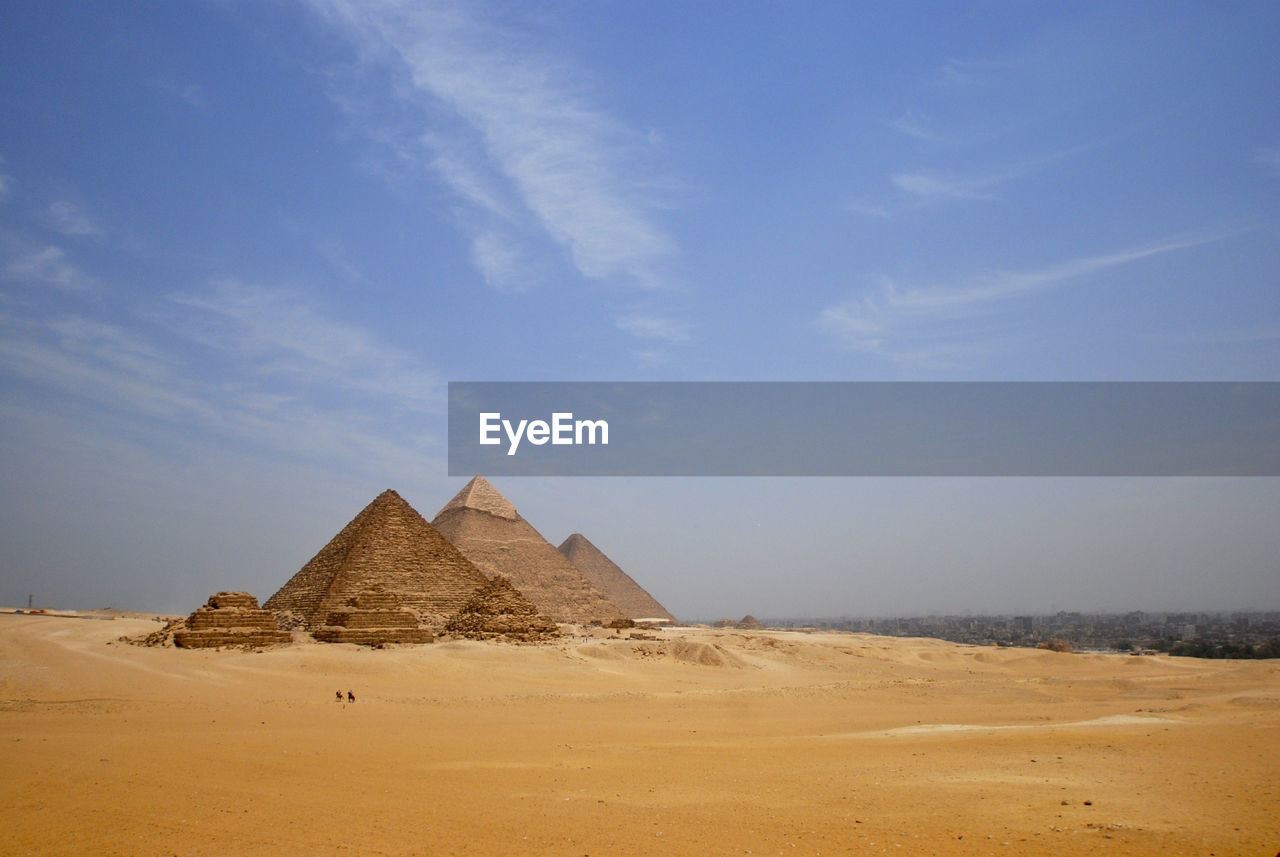 View of pyramids in desert against sky