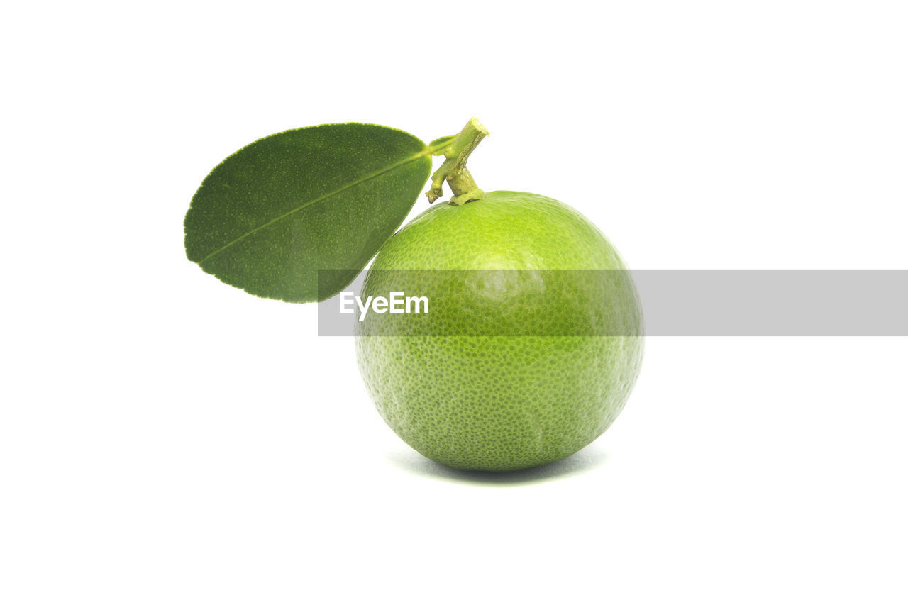 Close-up of lemon against white background