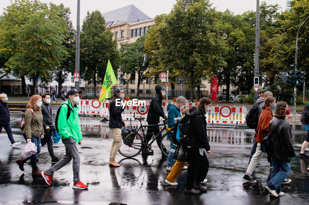 PEOPLE ON STREET IN RAINY SEASON