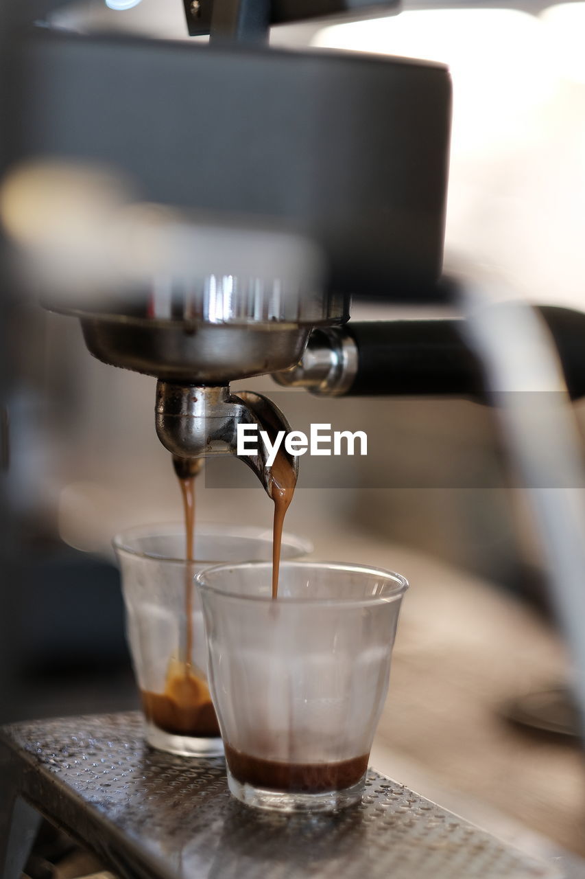 CLOSE-UP OF COFFEE CUP ON TABLE