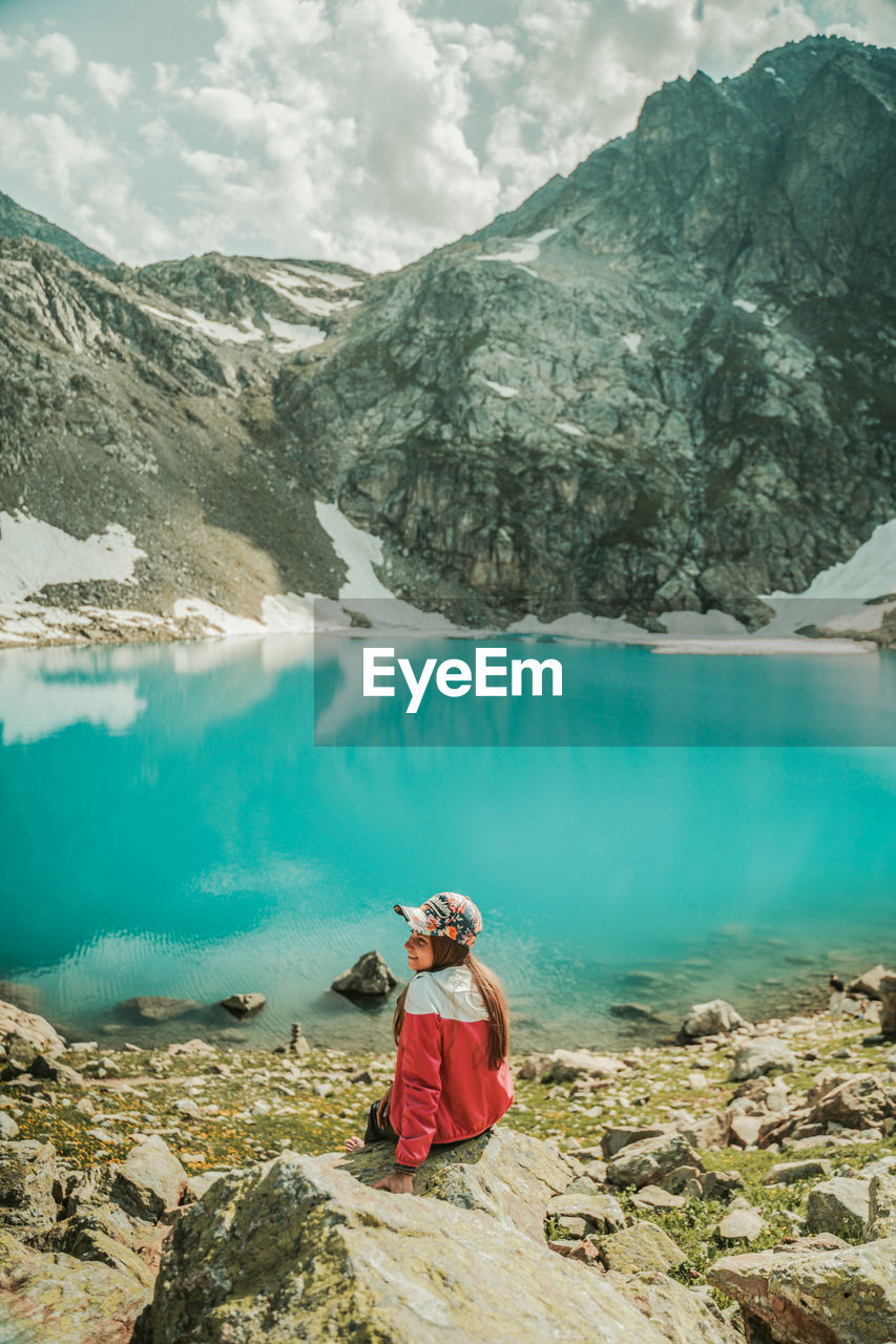 SCENIC VIEW OF LAKE AGAINST MOUNTAIN