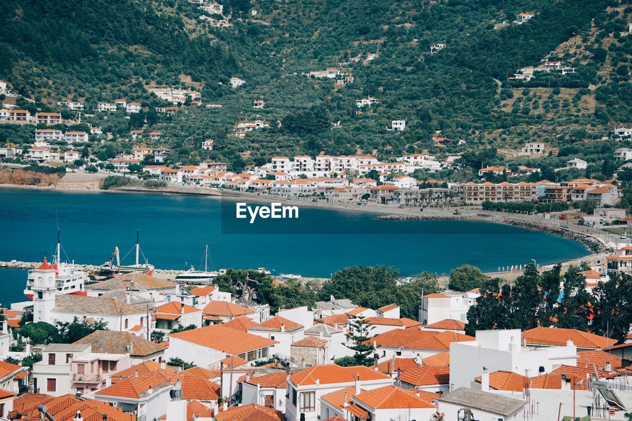 High angle view of townscape by sea