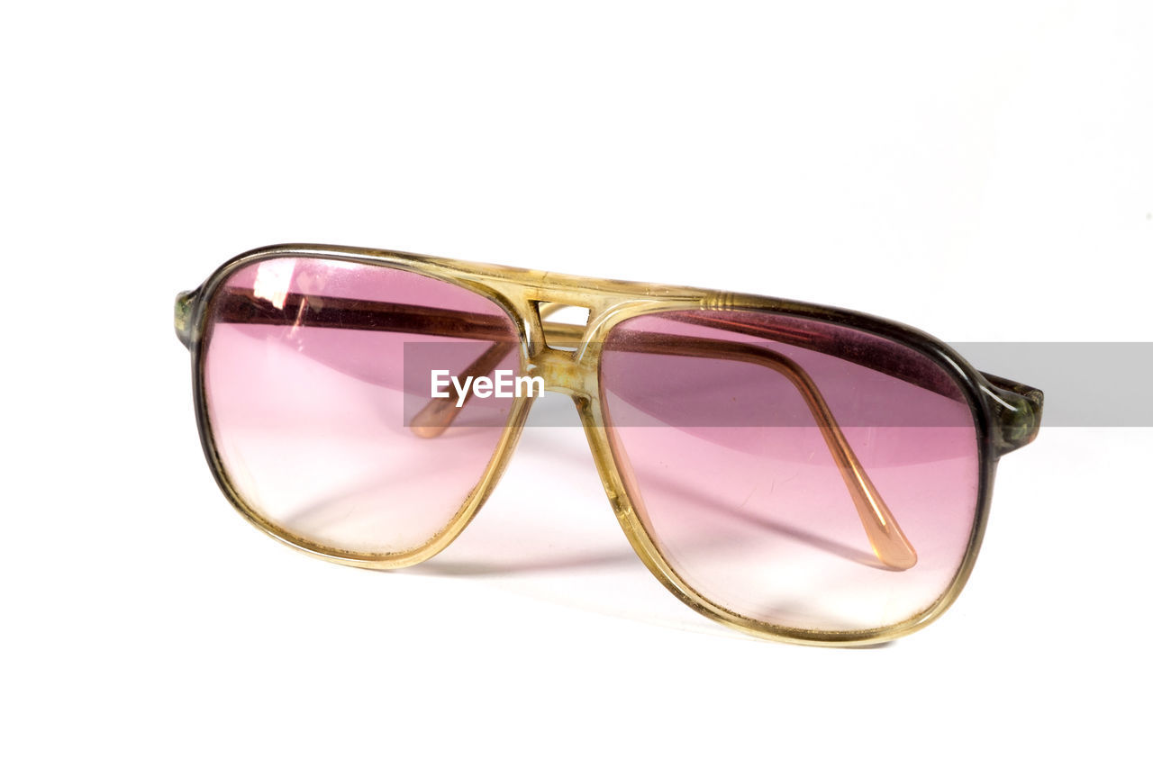 Close-up of sunglasses against white background