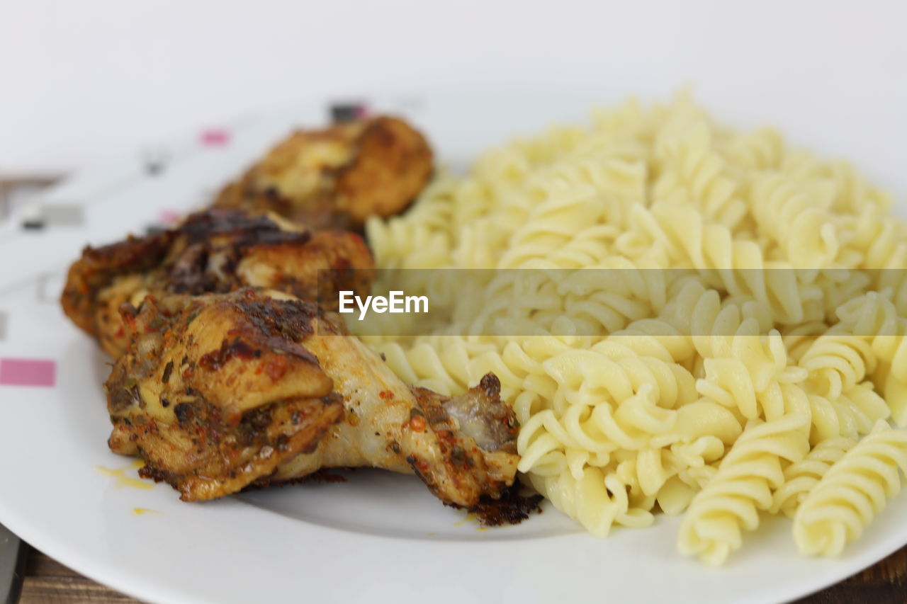 food, food and drink, plate, dish, freshness, cuisine, healthy eating, wellbeing, indoors, no people, close-up, meat, produce, meal, vegetable, italian food, fried food, chicken meat, chicken, focus on foreground, serving size, pasta