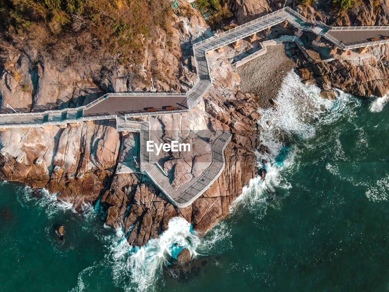 High angle view of rocks by sea