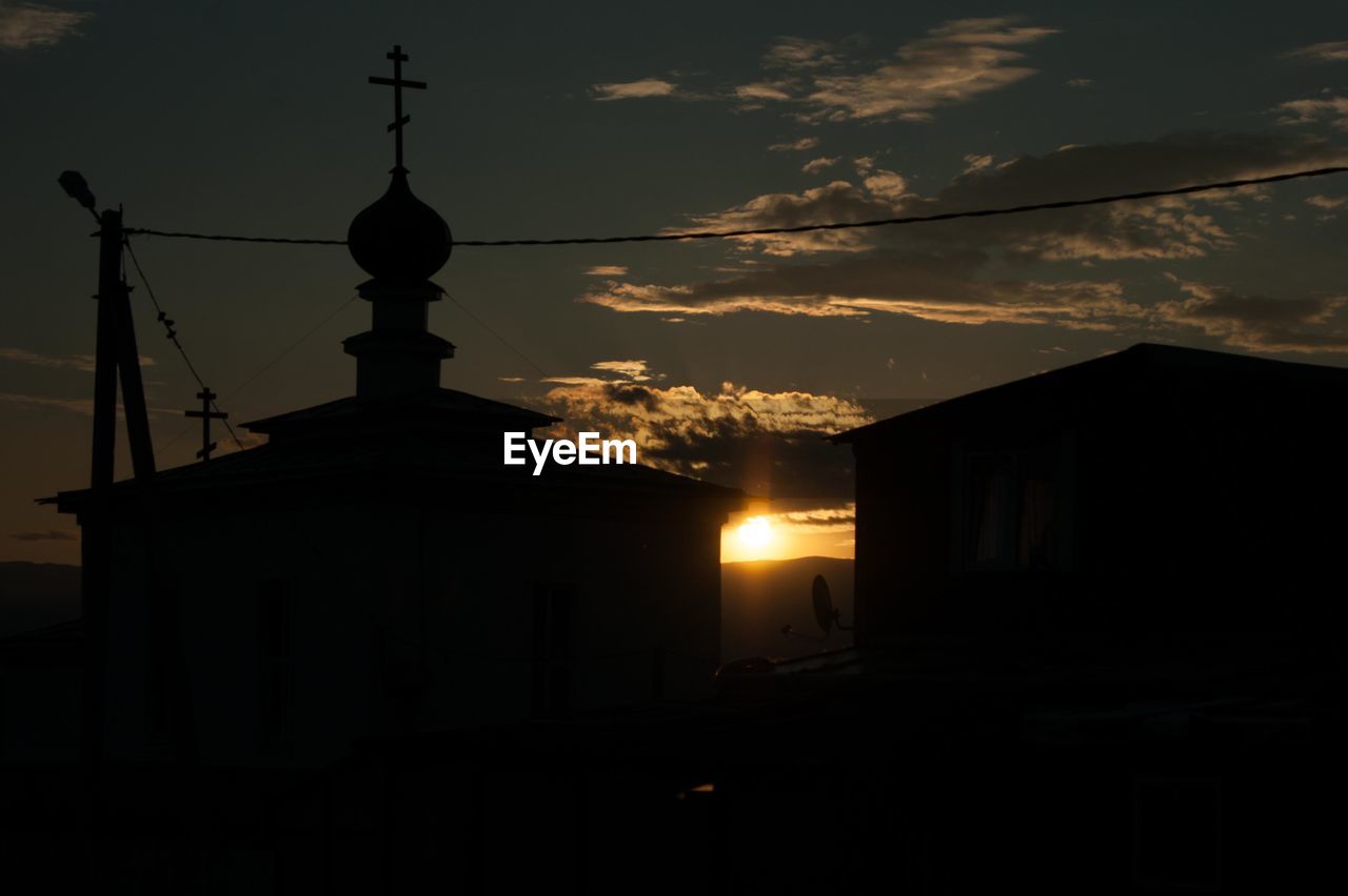 SILHOUETTE OF BELL TOWER DURING SUNSET