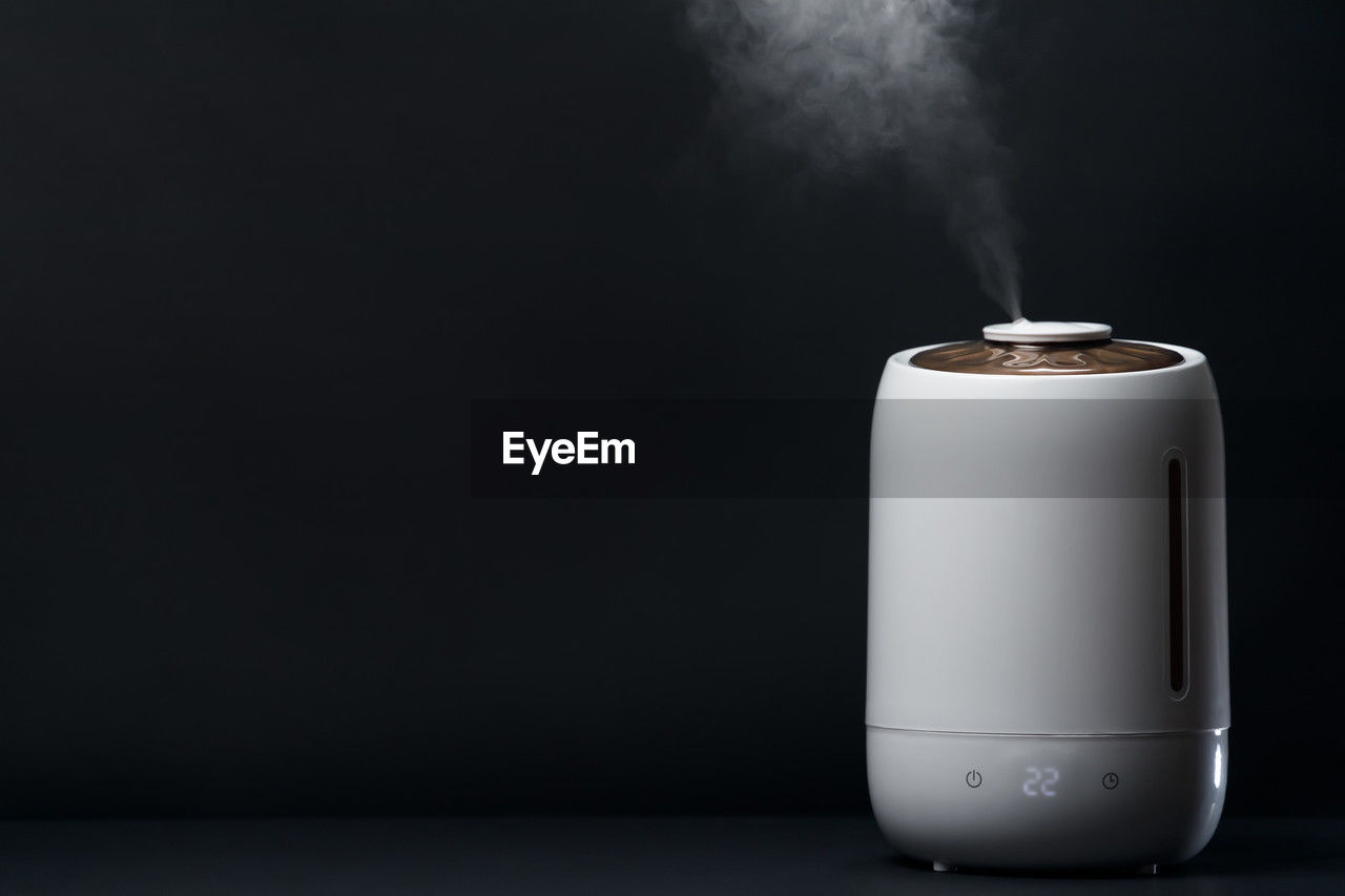 White air humidifier during work clean air and vaporizes steam up. aromatherapy at home.