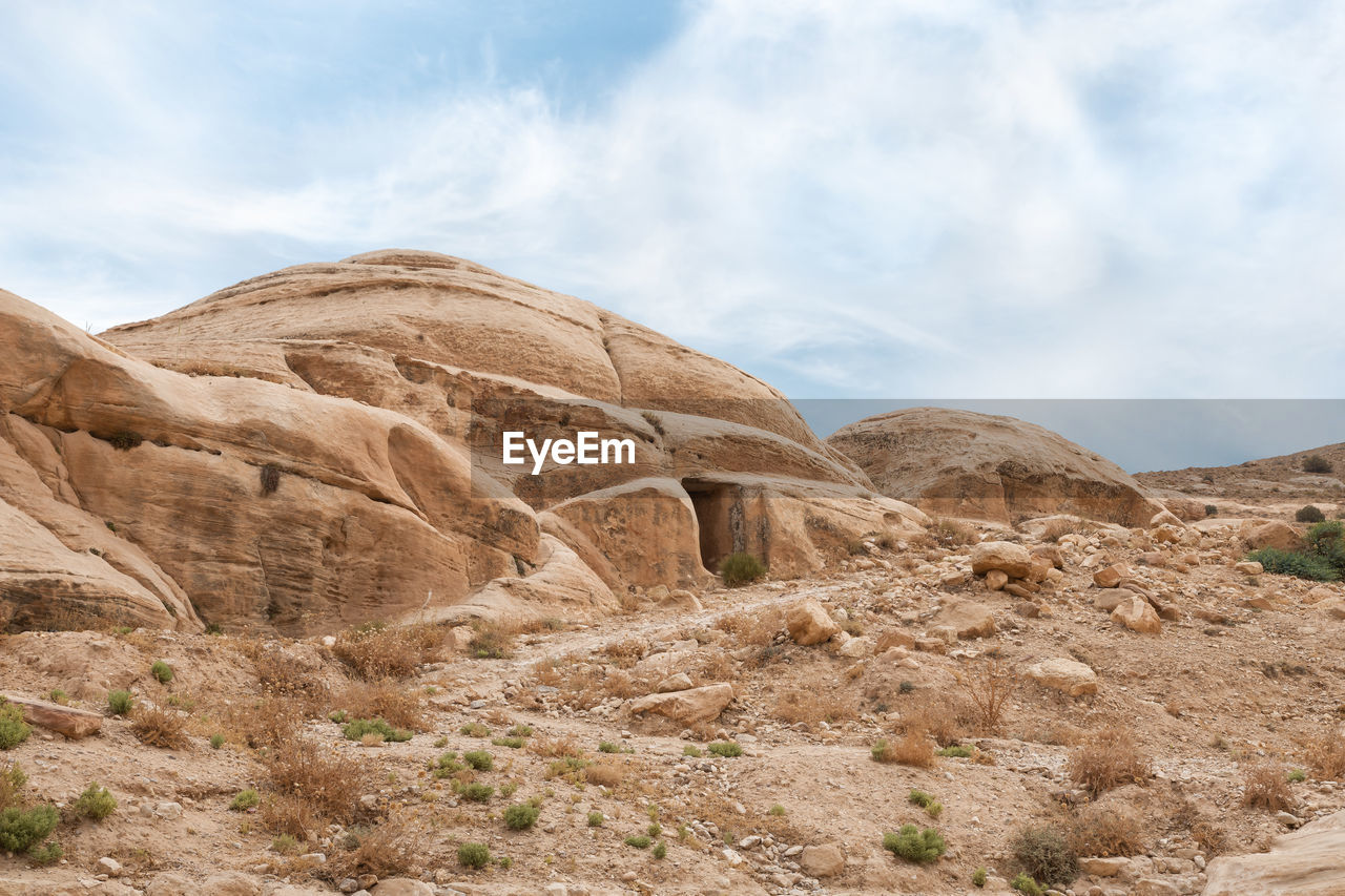 rock formations in desert against sky