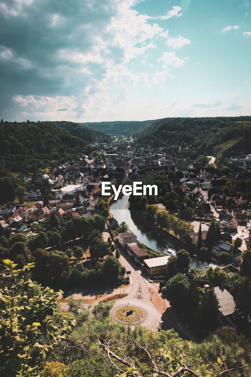 aerial photography, sky, nature, environment, landscape, architecture, cloud, city, aerial view, high angle view, building exterior, built structure, building, no people, scenics - nature, hill, land, travel destinations, outdoors, travel, plant, water, cityscape, beauty in nature, day, coast, tree, horizon, sea, residential district, tourism, sunlight, house