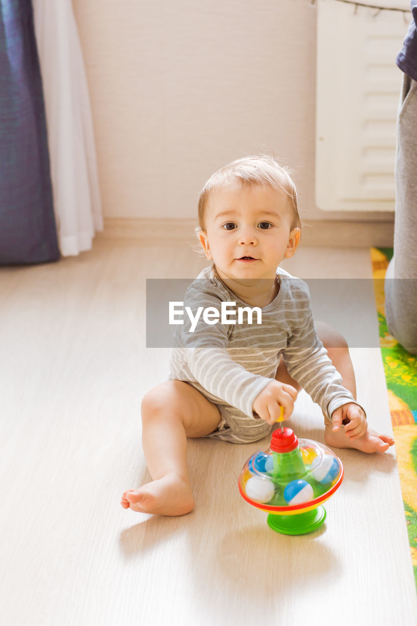 Portrait of cute baby boy at home