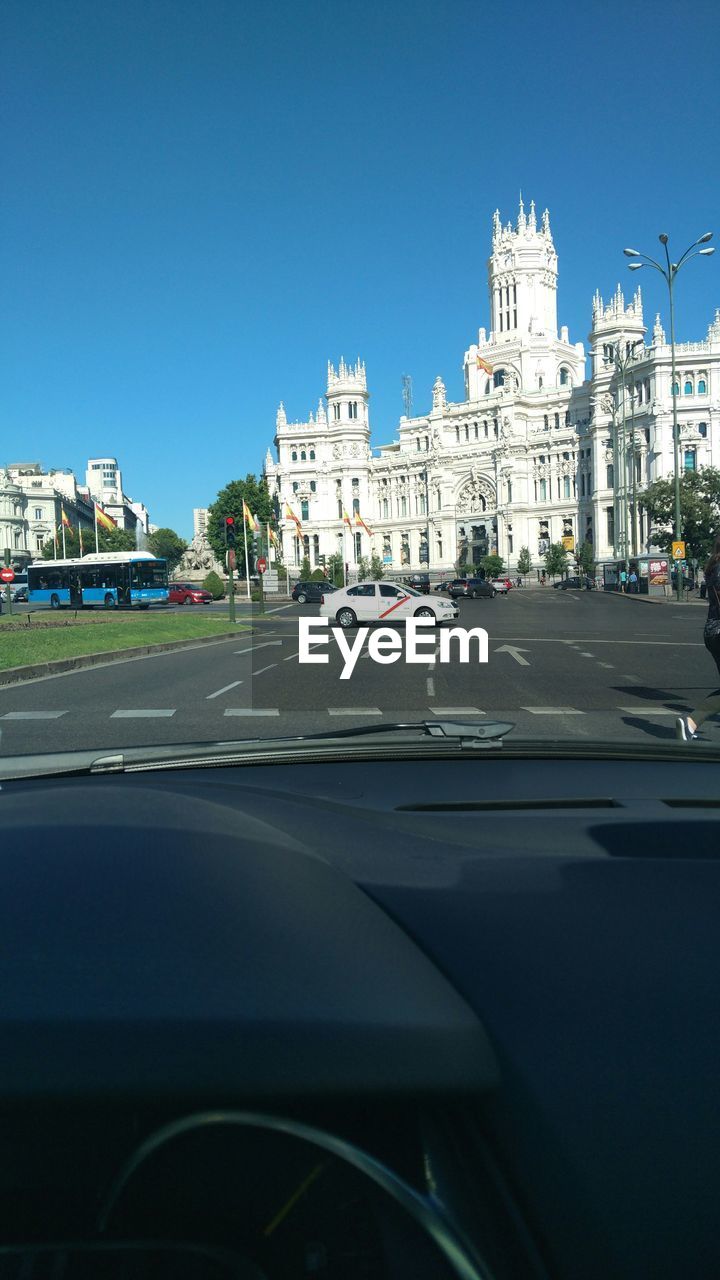 Plaza de cibeles against clear sky seen from car windshield