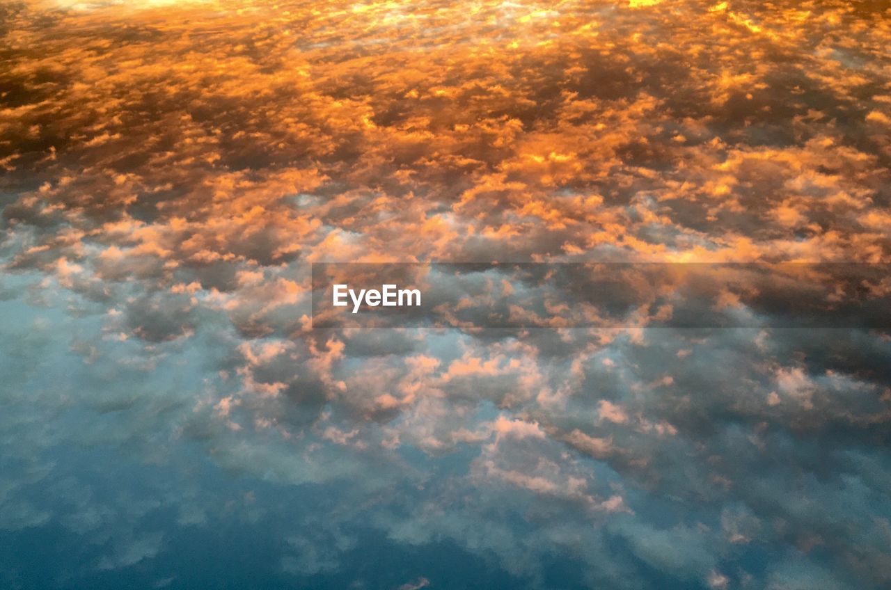 LOW ANGLE VIEW OF CLOUDSCAPE DURING SUNSET